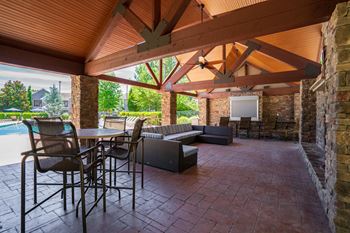 Outdoor cabana with tv, gas grills and wood burning fireplace